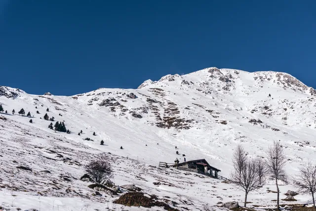 The snowy mountains, the woods and the mountain pastures during a fantastic winter day, near the town of Borno, Italy
