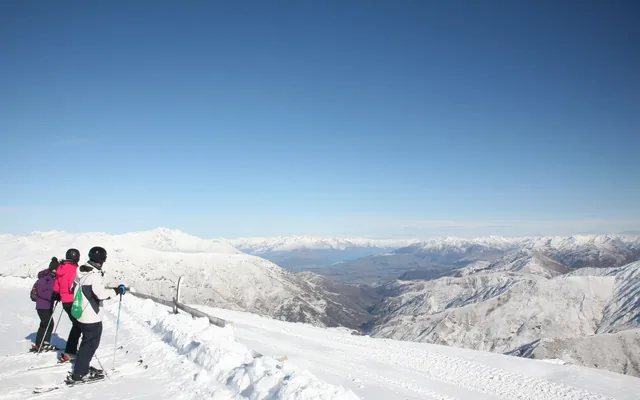 Skiers looking down from the Cardrona Ski Field near Wanaka, in Otago, on New Zealand South Island in winter