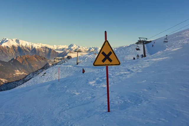 In the top of the mountain with sign in Italy - winter season - adventure snow - Aosta - Champorcher.