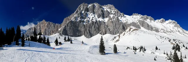 Ski Area Ehrwalder Alm With View To Mount Zugpitze Austria On A Beautiful Sunny Winter Day With a Clear Blue Sky