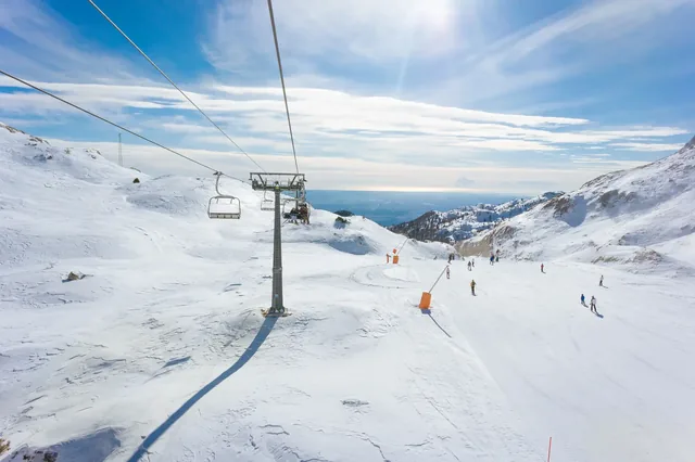Skilift and slopes in Piancavallo in a sunny winter day, near Mount Tremol and Cima Manera, Friuli Venezia Giulia
