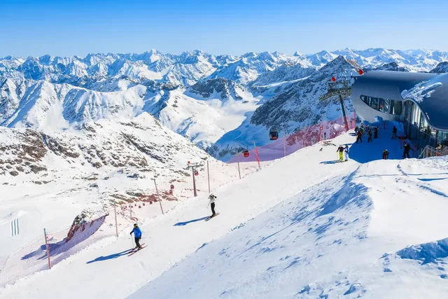 Skiers on slope in mountain winter resort of Pitztal, Austria